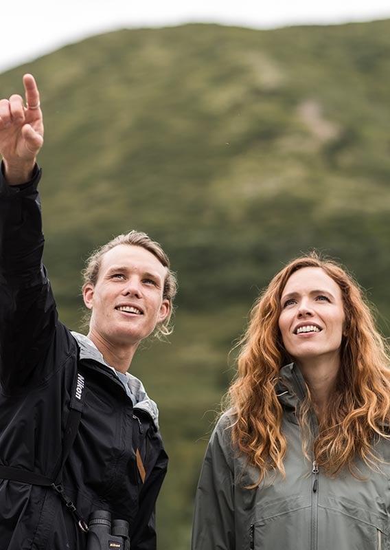 Two people smile and look in awe.