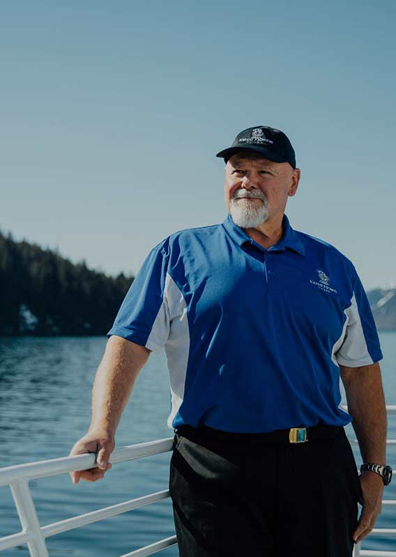 Captain Steve standing on the deck on a Kenai Fjords Tours Boat