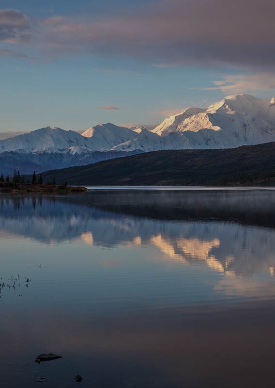 Denali mountains reflecting on Wonder Lake in the heart of Denali National Park