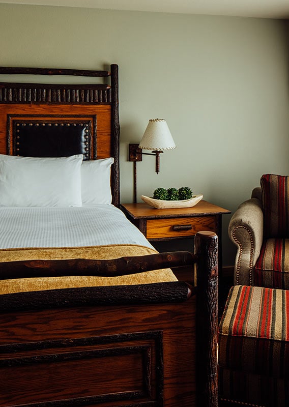 a bed side table and arm chair