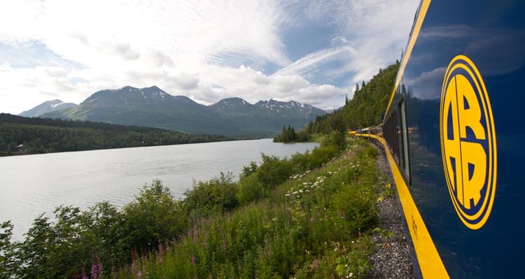 A view from the Alaska Railroad of a river and mountains.