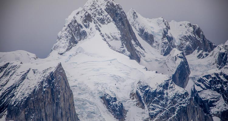 A stark mountain, covered in ice and snow.