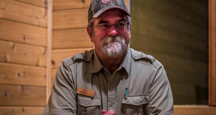 A portrait of Martin Brewer in a wooden room.