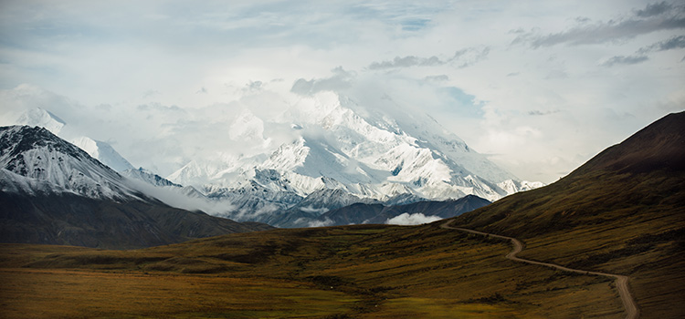 snow covered Denali peaks with clouds