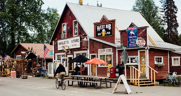 A wooden general store building on a small street.