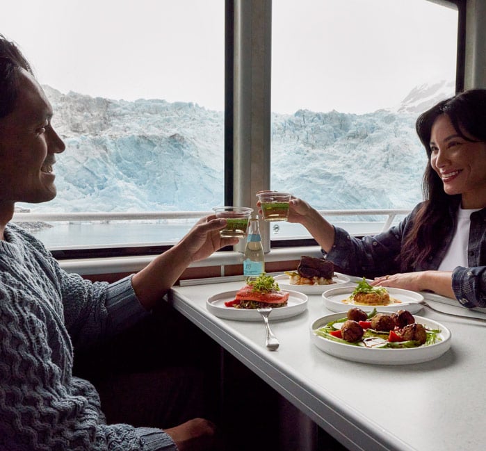 A couple dining on the Kenai Fjords Tour Dinner Cruise