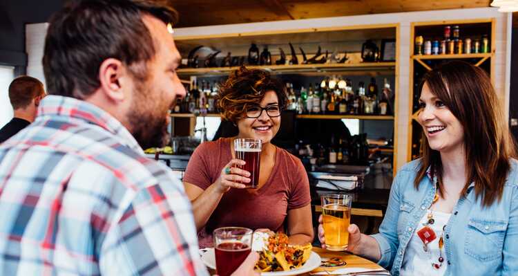 Friends dining at Prey Pub & Eatery