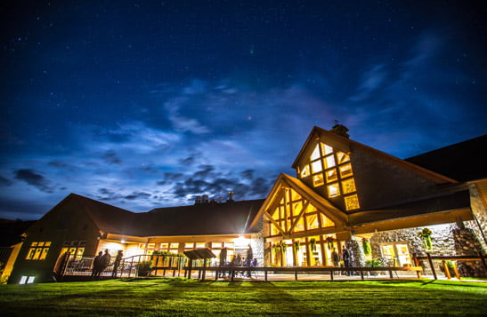An exterior view of Talkeetna Alaskan Lodge at night