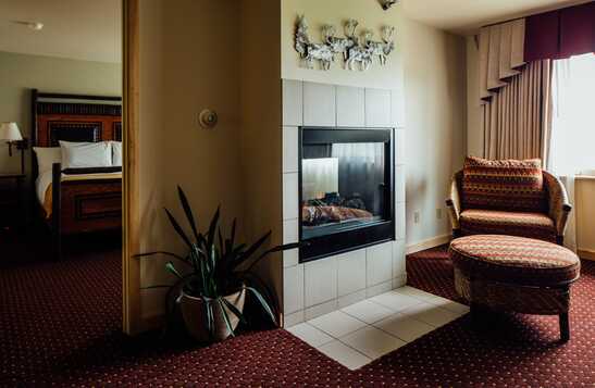 A man eating a salad at a windowside table.