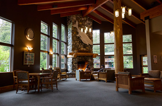 The Seward Windsong Lodge lobby seating area and fireplace