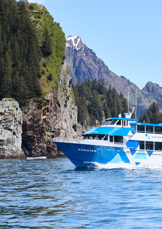 A KFT boat sailing by a group of islands