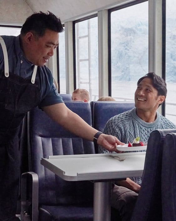 The Chef serving a guest dessert on the Kenai Fjords Tours Dinner Cruise.