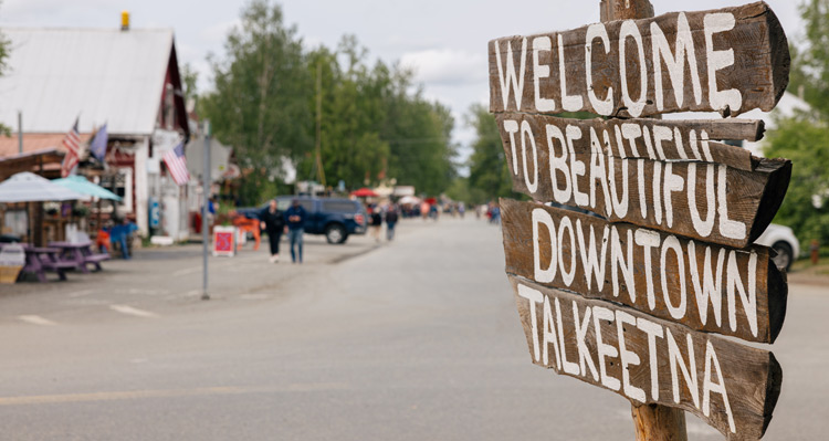 A close-up view of the Welcome to Beautiful Downtown Talkeetna sign.