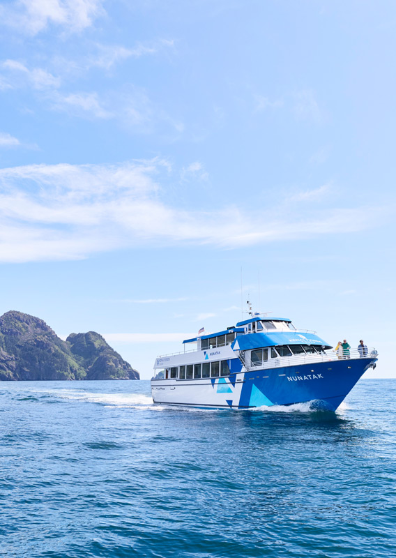 Kenai Fjords Resurrection Bay Tour boat sailing past islands