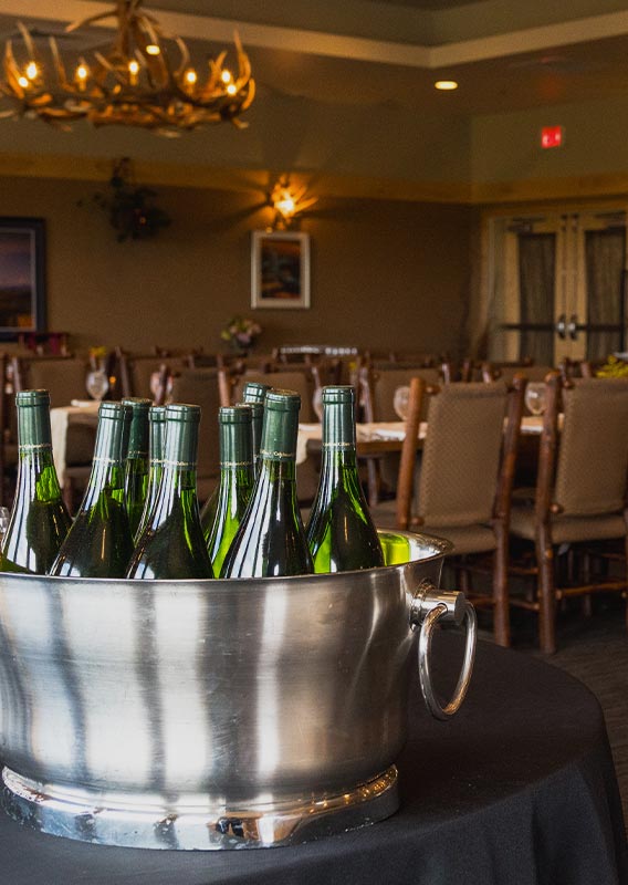 Wine bottles in a large holding bucket
