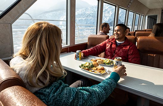 Two people dining on the KFT Glacier Dinner Cruise